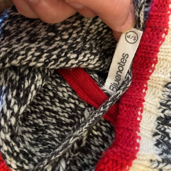 A turtle neck sweater. - Picture 1 of 2